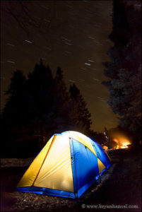 Boundary Waters campsite at night with star trails