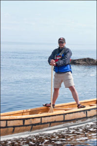 Standing on canoe gunwales in a Voyager canoe