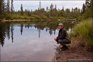 On the side of a river in the Boundary Waters.