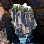 Sea kayaking under the arch at Tettegouche State Park.