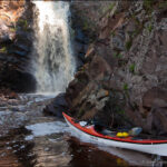 Kayak at the waterfall on the Fall River, Minnesota.