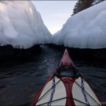 Winter ice and kayaking near it.