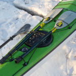 Spare kayak paddle carried on the front deck