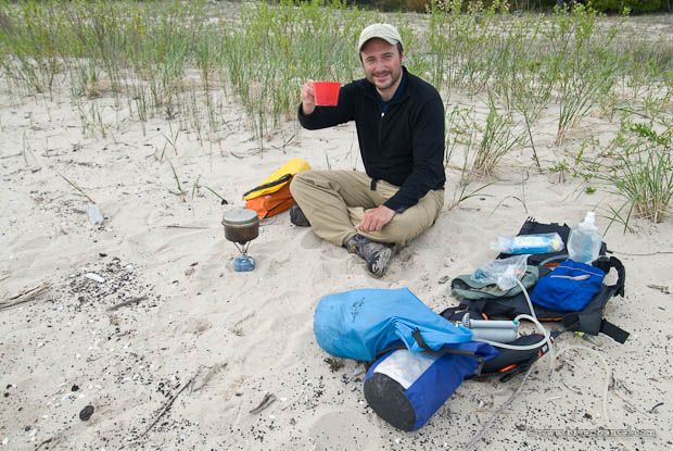 Bryan on the beach cooking supper.