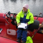 The boat captain with the waivers.
