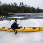 spring kayaking on Brule Lake with ice